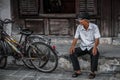 An old man is taking a break in hoi an, Quang Nam Province, Vietnam Royalty Free Stock Photo